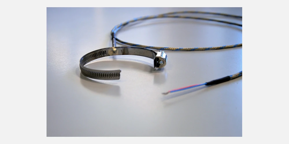 Type J thermocouple for surface temperature measurements on pipes or cylindrical bodies